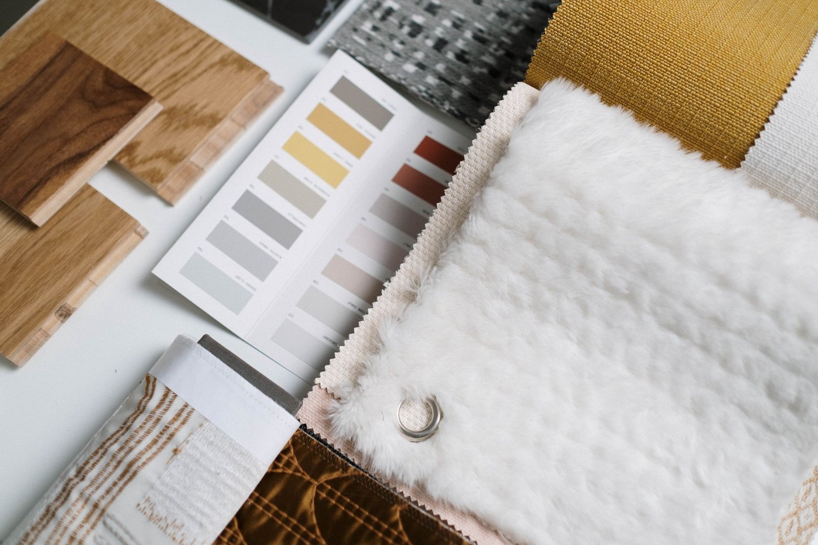 Fabric swatches and material samples used in an interior design project