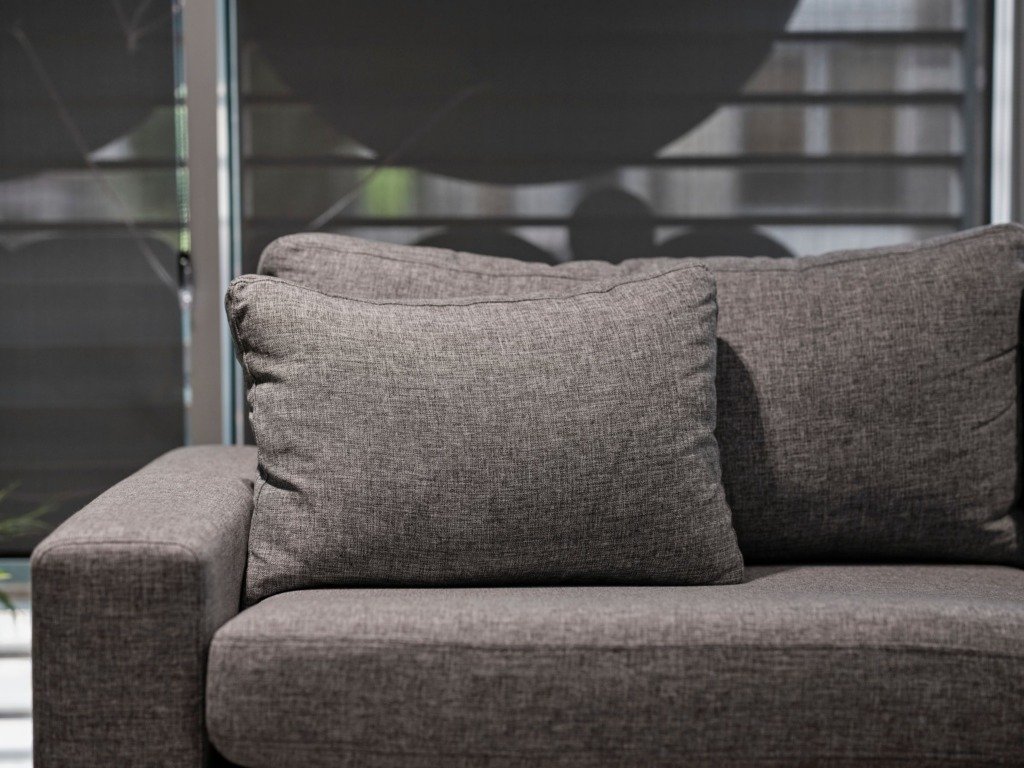 Elegant grey sofa with plush cushions in a contemporary living room setting, choosing a sofa for a Cairo home