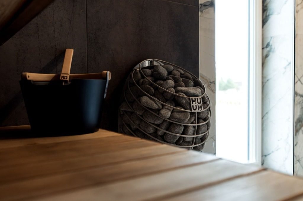 Timber surface with a stoneware bowl and woven basket, interior designer cost in azzar New Cairo
