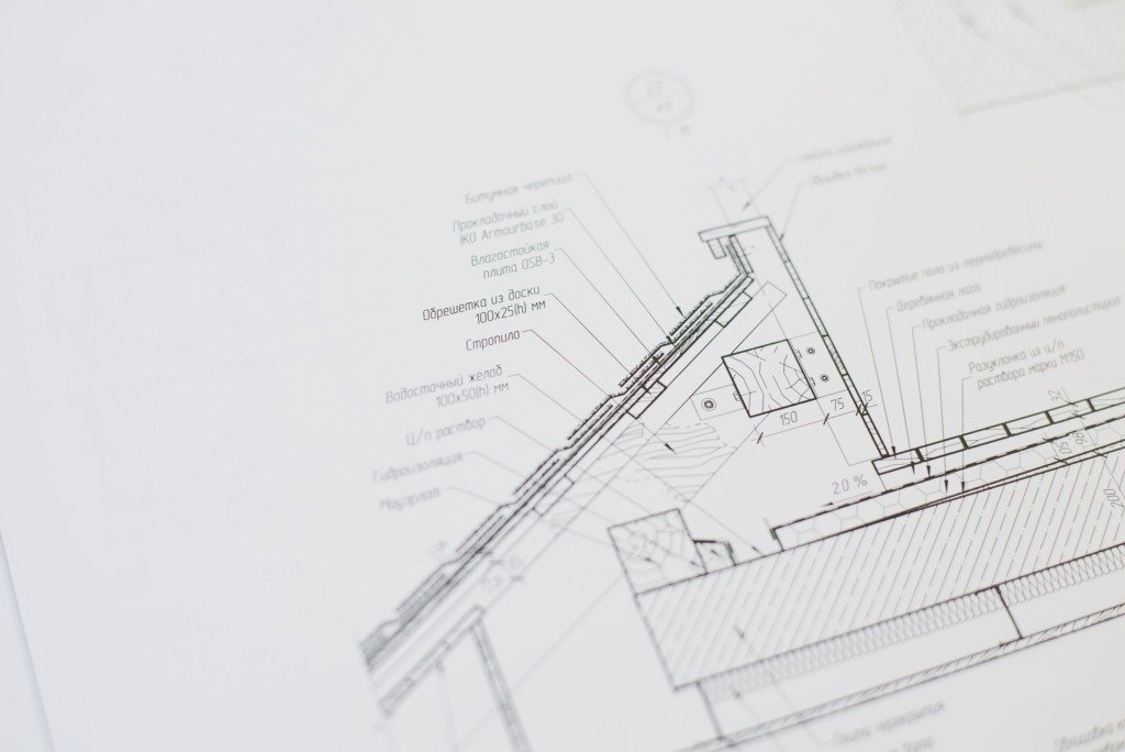Close-up of a detailed architectural floor plan focusing on technical elements and design specifications.