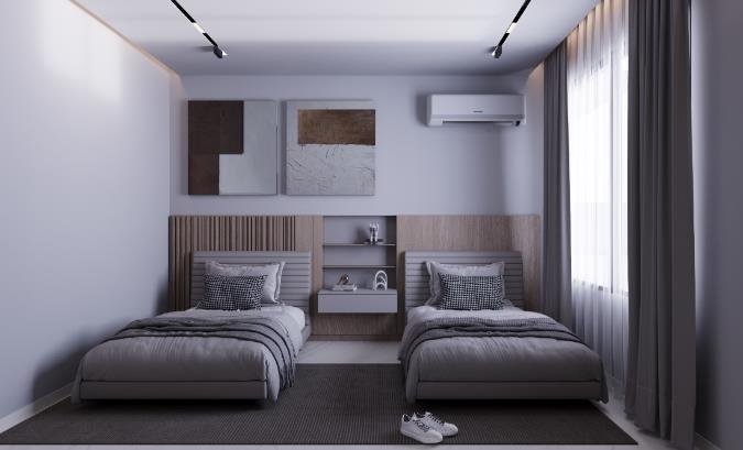 Twin bedroom in soft greys with a shared headboard wall and built-in shelf, Taj City Villa Project
